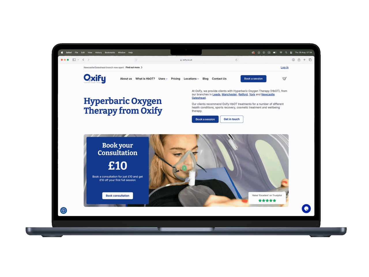 Oxify Hyperbaric Oxygen Therapy website on laptop screen.